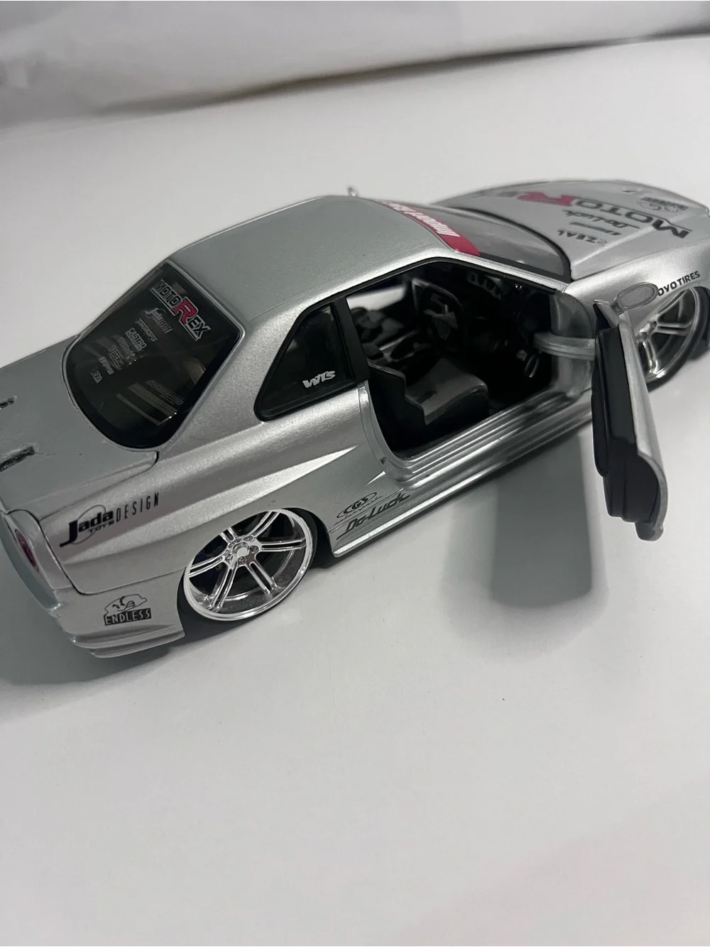 Nissan Skyline GT-R R34 Import Racer MotoRex Diecast 1:18 Escala - Coleccionable